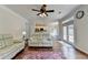 Bright living room with access to the kitchen and outdoor space at 189 Azalea Chase Dr, Suwanee, GA 30024