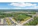 Extensive aerial view showcasing a Primary-planned community with sprawling greenery and established trees at 247 Widener Way, Peachtree City, GA 30269