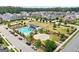 Aerial view showcases a community pool and green space with residences and street views at 247 Widener Way, Peachtree City, GA 30269