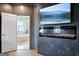 Modern bathroom with a soaking tub, walk-in shower, and neutral tiling at 247 Widener Way, Peachtree City, GA 30269