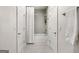 Bathroom featuring shower with tub, neutral colors, and doors on both sides at 247 Widener Way, Peachtree City, GA 30269