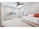 Bright bedroom featuring a daybed, white dresser, and windows letting in natural light at 247 Widener Way, Peachtree City, GA 30269