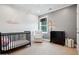 Calming Bedroom with crib, cozy chair, dresser, and window at 247 Widener Way, Peachtree City, GA 30269