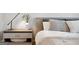 Stylish bedroom with bedside table, decorative lamp, and floral arrangement at 247 Widener Way, Peachtree City, GA 30269