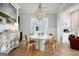 Elegant dining room featuring hardwood floors, stylish furnishings, a decorative chandelier and natural light at 247 Widener Way, Peachtree City, GA 30269