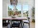 Dining room featuring hardwood floors, large windows and a modern light fixture at 247 Widener Way, Peachtree City, GA 30269