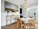 Elegant dining room featuring hardwood floors, stylish furnishings and a decorative chandelier at 247 Widener Way, Peachtree City, GA 30269