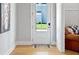 Bright entryway featuring a white door and wood flooring, leading to an office space at 247 Widener Way, Peachtree City, GA 30269