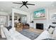 Spacious living room featuring a stone fireplace, comfortable seating, and an open view to the dining area at 247 Widener Way, Peachtree City, GA 30269