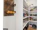 Well-organized walk-in pantry with ample shelving and storage space at 247 Widener Way, Peachtree City, GA 30269