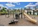 Community playground with slides, climbing structures, and ample space for children to play at 247 Widener Way, Peachtree City, GA 30269