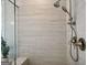 Tiled shower with glass enclosure and dual shower head offers a spa-like experience at 247 Widener Way, Peachtree City, GA 30269