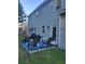Backyard patio with seating area featuring a grill, patio rug, and outdoor decor at 3675 Brookhollow Dr, Douglasville, GA 30135