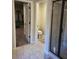 Bathroom featuring tile floors, walk-in shower with glass door, and separate toilet area at 3675 Brookhollow Dr, Douglasville, GA 30135