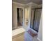 Contemporary bathroom with a glass-enclosed shower and neutral color palette at 3675 Brookhollow Dr, Douglasville, GA 30135