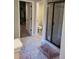 Bathroom featuring tile floors, walk-in shower with glass door, and separate toilet area at 3675 Brookhollow Dr, Douglasville, GA 30135