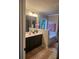 Elegant bathroom with a double sink vanity, bathtub, and stylish decor at 3675 Brookhollow Dr, Douglasville, GA 30135