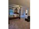 Bright bedroom featuring a grand canopy bed and ample closet space for storage at 3675 Brookhollow Dr, Douglasville, GA 30135