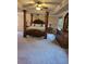 Cozy bedroom featuring a luxurious canopy bed, wooden furnishings, and soothing ambiance at 3675 Brookhollow Dr, Douglasville, GA 30135