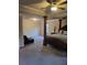 Large bedroom boasting a decorative canopy bed, ceiling fan, and expansive layout at 3675 Brookhollow Dr, Douglasville, GA 30135