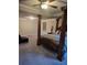 Spacious bedroom featuring a striking canopy bed, ceiling fan, and comfortable carpet at 3675 Brookhollow Dr, Douglasville, GA 30135
