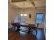 Dining room with coffered ceiling, decorative chandelier, and wood flooring at 3675 Brookhollow Dr, Douglasville, GA 30135