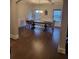 Dining room with chandelier lighting, coffered ceiling, and wood floors at 3675 Brookhollow Dr, Douglasville, GA 30135