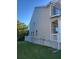 Side view of a two-story home featuring neutral siding and manicured lawn at 3675 Brookhollow Dr, Douglasville, GA 30135