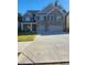 Beautiful brick two-story home with well-manicured lawn and spacious driveway at 3675 Brookhollow Dr, Douglasville, GA 30135