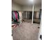 Spacious walk-in closet with carpeting and clothing racks for ample storage at 3675 Brookhollow Dr, Douglasville, GA 30135
