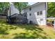 The home features a spacious backyard, a dark wood deck, and a walkout basement at 1172 Colony Dr, Marietta, GA 30068