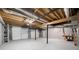 Spacious basement area with garage, painted floor, and exposed ceiling is ready for customization at 1172 Colony Dr, Marietta, GA 30068