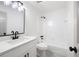 This bathroom features a single sink vanity, white cabinetry, and a shower-tub combination at 1172 Colony Dr, Marietta, GA 30068