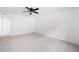 This bedroom boasts neutral carpeting, a ceiling fan, and crisp white walls for a clean aesthetic at 1172 Colony Dr, Marietta, GA 30068