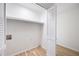 Walk-in closet with built in shelving and light-colored hardwood flooring at 1172 Colony Dr, Marietta, GA 30068