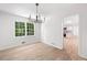 A bright formal dining room featuring new hardwood floors, and new trim at 1172 Colony Dr, Marietta, GA 30068