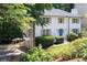 Beautiful two-story home showcases its white siding, complemented by a manicured lawn and driveway with white gate at 1172 Colony Dr, Marietta, GA 30068
