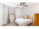 Comfortable bedroom with neutral tones, a white bed, and a ceiling fan for added comfort at 1902 Seals Rd, Dallas, GA 30157