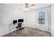 Bright bedroom with a desk, carpeting, a chair, and a window providing plenty of natural light at 1902 Seals Rd, Dallas, GA 30157