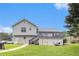 Back exterior view of home showing deck, lawn, and storage at 1902 Seals Rd, Dallas, GA 30157