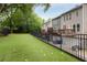 Large backyard with artifical grass and fences at 2305 Limehurst Ne Dr # 21, Atlanta, GA 30319