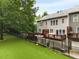 A fenced backyard with well maintained artificial grass at 2305 Limehurst Ne Dr # 21, Atlanta, GA 30319
