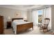Bedroom with natural light, a wooden rocking chair, neutral carpet and white trim at 2305 Limehurst Ne Dr # 21, Atlanta, GA 30319