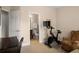 Bonus room showcasing access to the bathroom, a comfortable chair, and workout equipment at 2305 Limehurst Ne Dr # 21, Atlanta, GA 30319