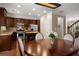 Open concept dining area features hardwood floors, modern lighting and views to the kitchen and backyard at 2305 Limehurst Ne Dr # 21, Atlanta, GA 30319