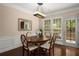 Inviting dining area with hardwood floors, wainscoting, and a window offering plenty of natural light at 2305 Limehurst Ne Dr # 21, Atlanta, GA 30319