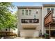 Townhome exterior featuring an attached garage and balcony at 2305 Limehurst Ne Dr # 21, Atlanta, GA 30319
