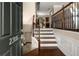 Inviting foyer with hardwood floors and staircase leading to the main living area in the house at 2305 Limehurst Ne Dr # 21, Atlanta, GA 30319