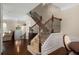 Elegant foyer with staircase featuring detailed ironwork and wood handrail at 2305 Limehurst Ne Dr # 21, Atlanta, GA 30319