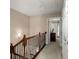 Hallway with wood railing, carpeted floor, and closed doors at 2305 Limehurst Ne Dr # 21, Atlanta, GA 30319